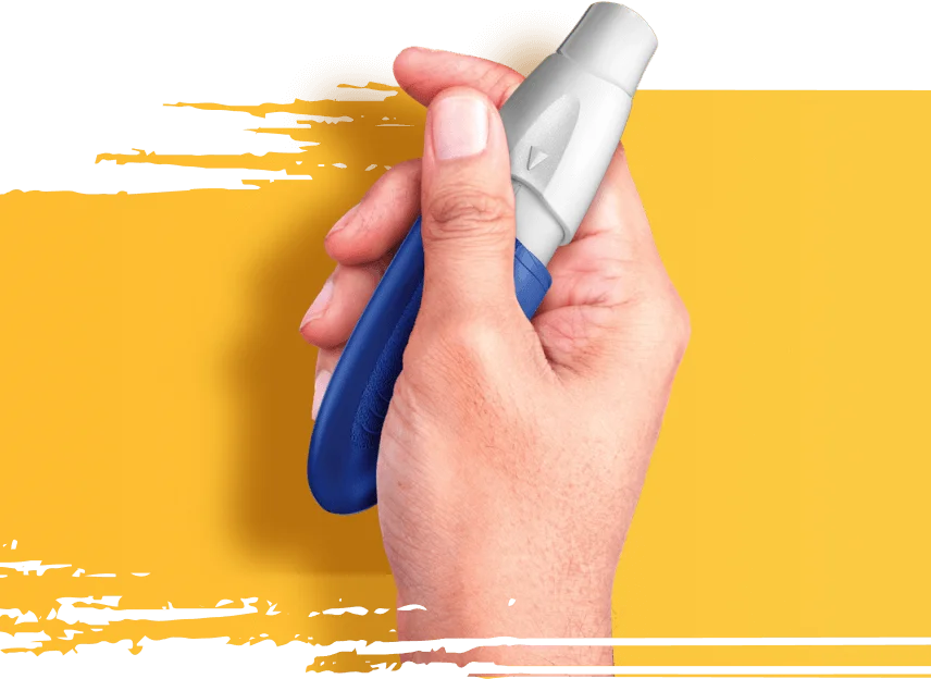 Close crop of a hand holding the INBRIJA inhaler.